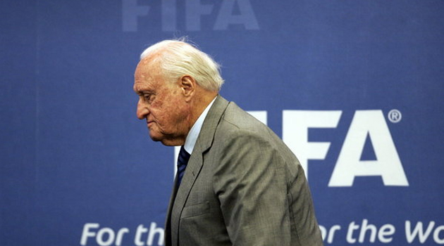 Joao Havelange in front of FIFA sign