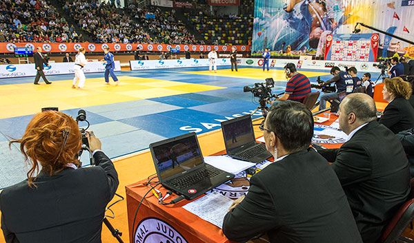 Judo Two referees with the CARE system video refereeing are present at the officials table