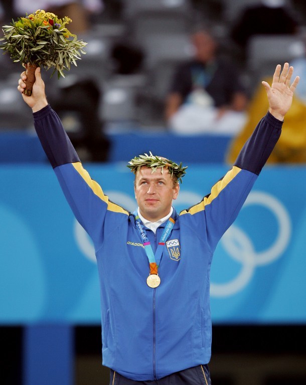 Yuriy Bilonoh celebrates winning the Olympic gold medal in the shot put at Ancient Olympia in 2004
