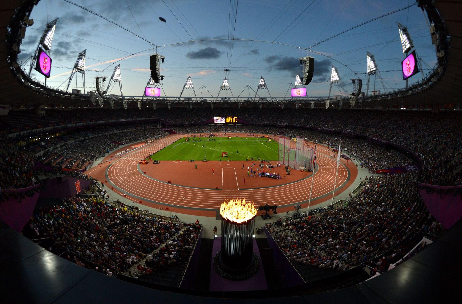 Olympic Stadium at night with flame