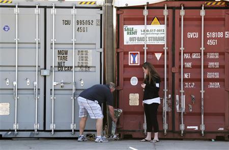 Flowers are placed by a storage container at the Artemis storage facility in California