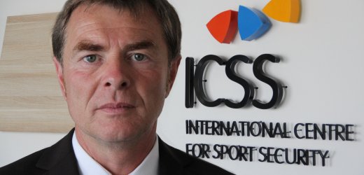 Helmut Spahn in front of ICSS logo