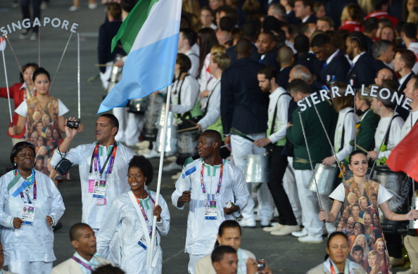 Long jumper Ola Isata Sesay leads the Sierra Leone delegation as the nations flagbearer at the London 2012 Olympic Opening Ceremony