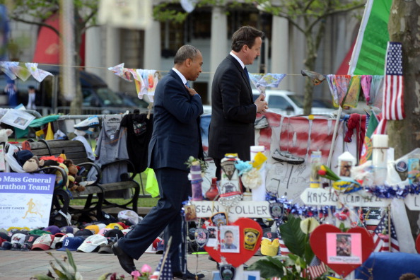 UK Prime Minister David Cameron and Massachusetts Governor Deval Patrick visit the memorial to the Boston Marathon bombing victims on Boylston Street on May 14 2013