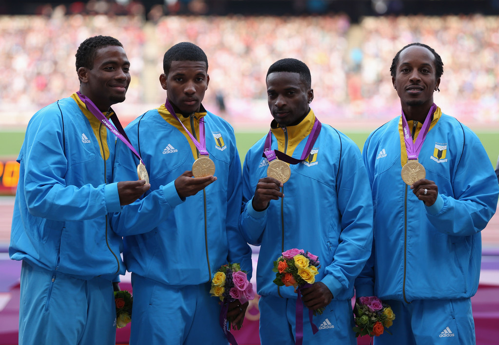 Chris Brown Demetrius Pinder Michael Mathieu and Ramon Miller of the Bahamas pose on the podium during the medal ceremony for the Mens 4 x 400m Relay