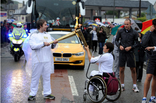 Emmanuelle Assmann carrying Olympic torch London 2012