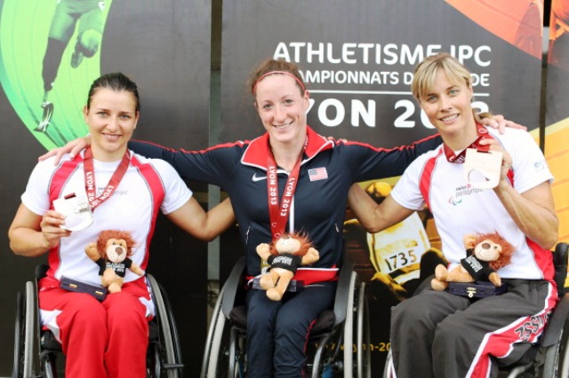 American Tatyana McFadden centre celebrates her third gold medal of the IPC World Athletics Championships following victory and a new world record in the T54 800m