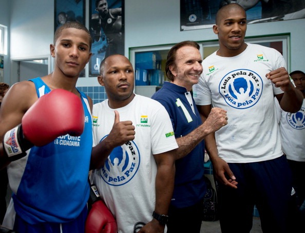 London 2012 gold medallist Anthony Joshua far right along with Formula One legend Emerson Fittapaldi at a Fight for Peace project in Rio de Janeiro