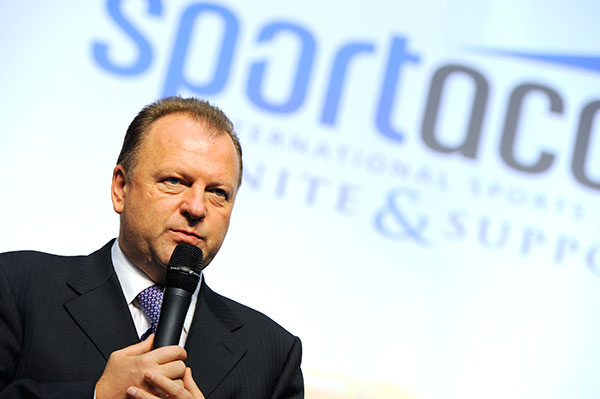 Marius Vizer in front of SportAccord sign