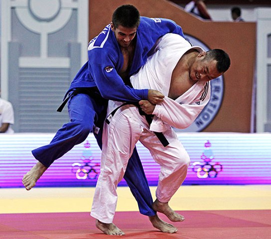 Michal Horak grapples with Gedelefu Wu of China at the Mongolian Judo Grand Prix