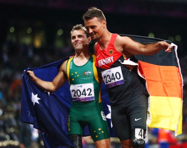 New world record holder Heinrich Popow and Scott Reardon embrace following the mens 100m T42 final at London 2012