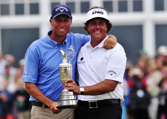 Phil Mickelson ight celebrates his 2013 Open Championship win at Muirfield with caddie Jim Bones Mackay