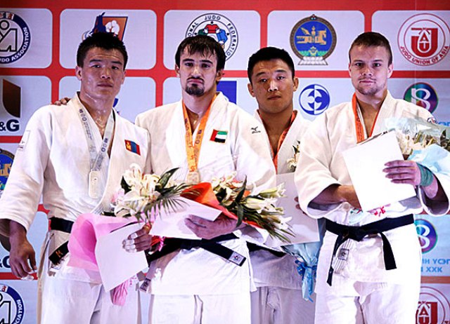 Segiu Toma second from left won the UAEs first ever interbational judo gold medal in the mens -81kg category