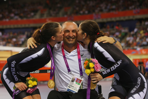 Gold medalists Laura Thompson and Phillipa Gray of New Zealand celebrate with New Zealand Chef de Mission Duane Kale after winning the Womens Individual B Pursuit