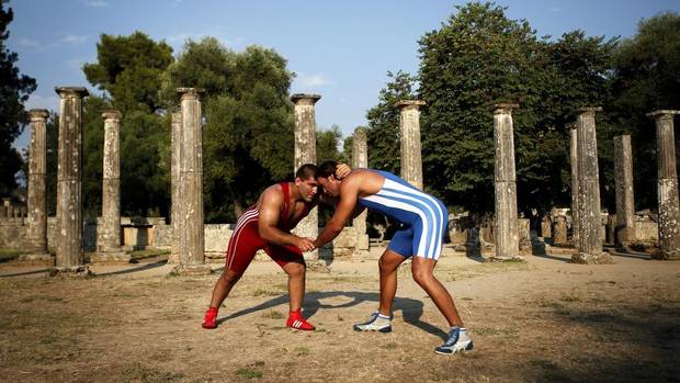 Greek wrestlers promote their sport in ancient Olympia