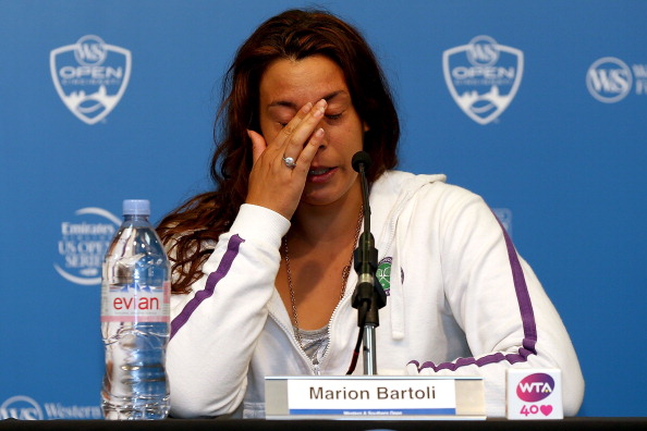 Marion Bartoli announced her retirement because of persistent injuries following her second round defeat in the Western and Southern Open in Cincinnati 