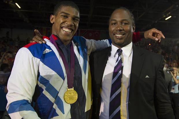 Anthony Joshua with Lennox Lewis and gold medal