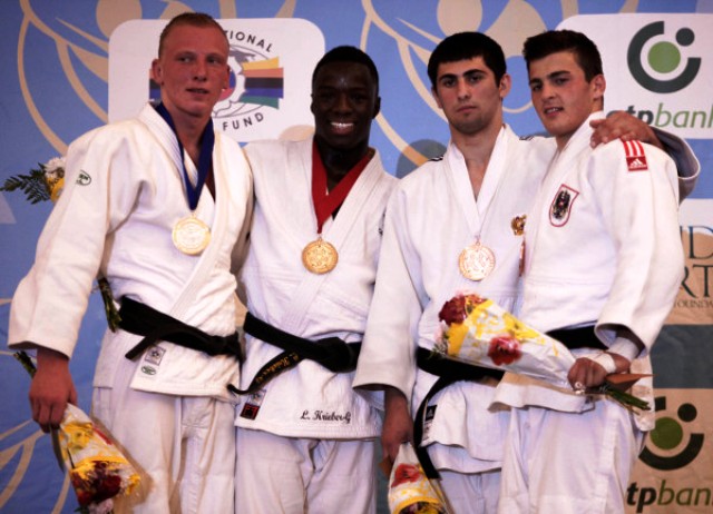 Canadas Louis Krieber Gagnon second left shows his delight at becoming his countrys first male cadet world champion in Miami