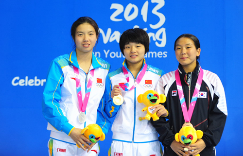China led the way with two gold and two silver medals in diving, with Yi Shen taking gold ahead of Weiiie Wang (left) as South Korea's Kim Suji took bronze
