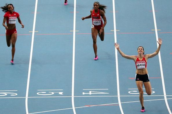 Czech Republic's Zuzana Hejnova wins the world 400 metres hurdles title with a dominant display in Moscow, beating America's defending champion Lashinda Demus
