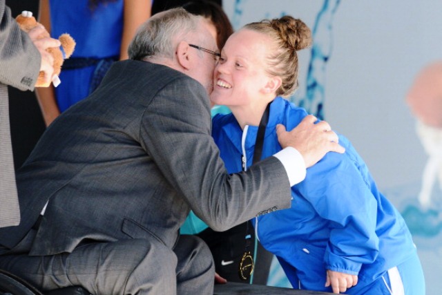 Ellie Simmonds of Graet Britain receives her gold medal from IPC President Sir Phillip Craven in Montreal