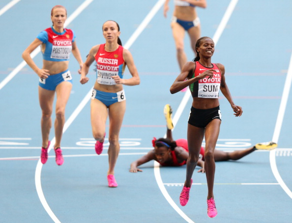 Eunice Jepkoech Sum of Kenya crosses the line to win gold ahead of Russia's Mariya Savinova in the women's 800 metres final at the World Championships