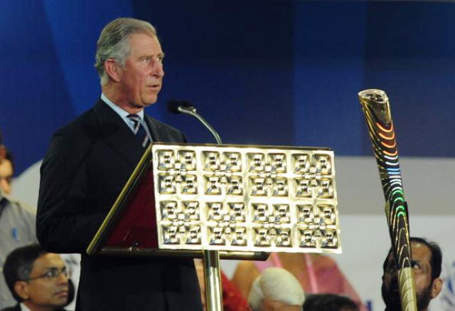 HRH the Prince of Wales pictured with the Queens Baton at the opening of the 2010 Commonwealth Games in Delhi