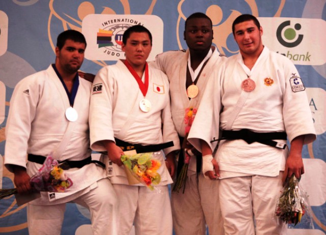 Hyoga Ota of Japan second left earned his countrys fifth gold medal at the World Cadet Championships in Miami