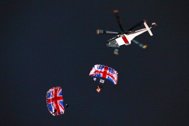 Mark Sutton and Gary Connery jump from a helicopter over the Olympic Stadium during the London 2012 Opening Ceremony