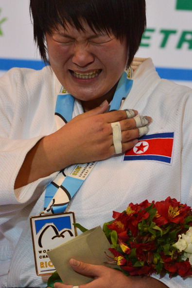 North Korea's new champion Kyong Sol cries on the podium during the medal ceremony for the women'sunder 78kg category 