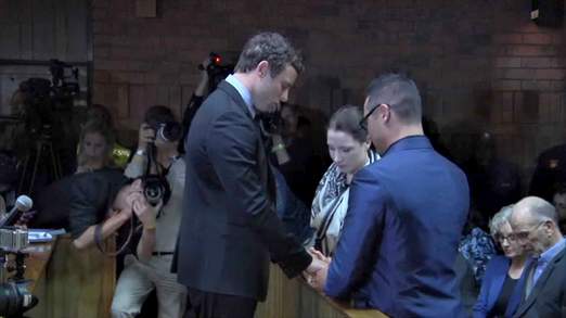 Oscar Pistorius prayed with his brother and sister before the hearing at Pretoria Magistrates'  Court started today
