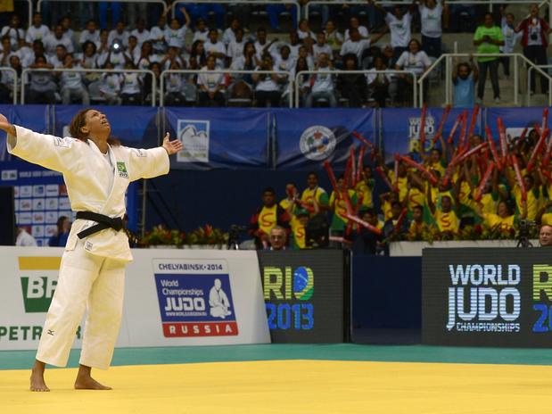 Rafaela Silva celebrates winning the gold medal at the World Championships as the home crowd join in