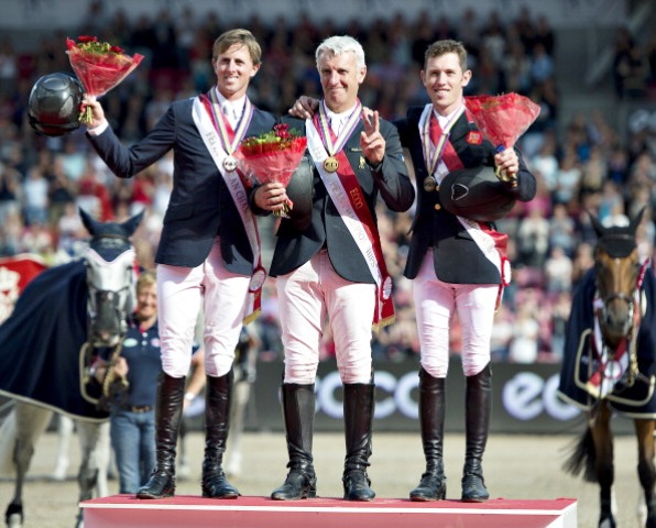 Roger-Yves Bost (centre) takes the plaudits after finishing ahead of Britons Ben Maher (left) and Scott Brash in Herning