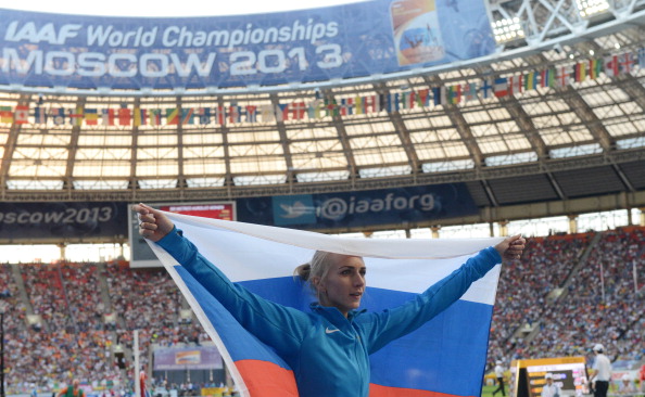 Russia's Svetlana Shkolina celebrates her victory in the high jump before her home crowd in Moscow