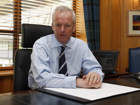 Simon Clegg in Ipswich Town office