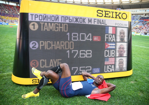 France's Teddy Tamgho relaxes after moving to third on the all-time triple jump list with victory at the World Championships with a best effort of 18.04 metres