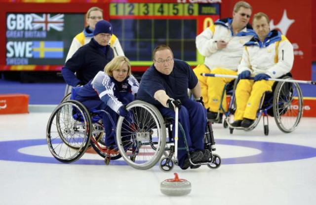 Tom Killin in action during the wheelchair curling competition at Turin 2006
