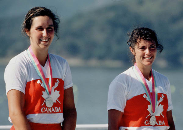 Canada's Tricia Smith (left) and her partner Betty Craig celebrate their Olympic silver medal at Los Angeles 1984