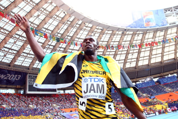 Usain Bolt celebrates his third gold medal of the IAAF World Championships in Moscow after anchoring Jamaica to victory in the 4x100 metres relay