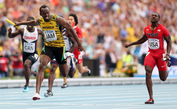 Usain Bolt holds off America's Justin Gatlin to anchor Jamaica to the gold medal in the 4x100 metres relay at the World Championships in Moscow