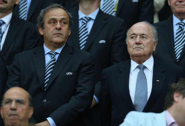 Michel Platini (left) is considering whether to challenge Sepp Blatter (right) for FIFA Presidency