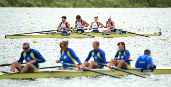 Britain (background) have won the para-rowing mixed coxed four world title in South Korea