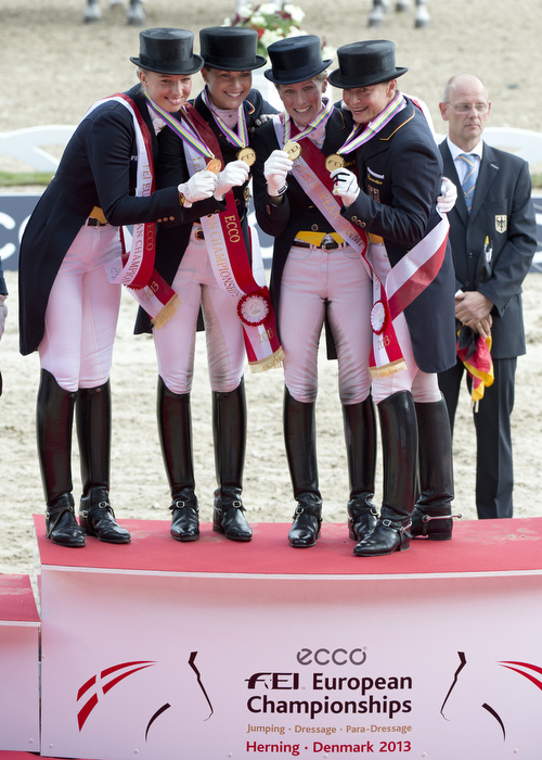 Germany's dressage team celebrate their victory, which was achieved against Britain's Charlotte Dujardin and her mount Valegro setting a world record