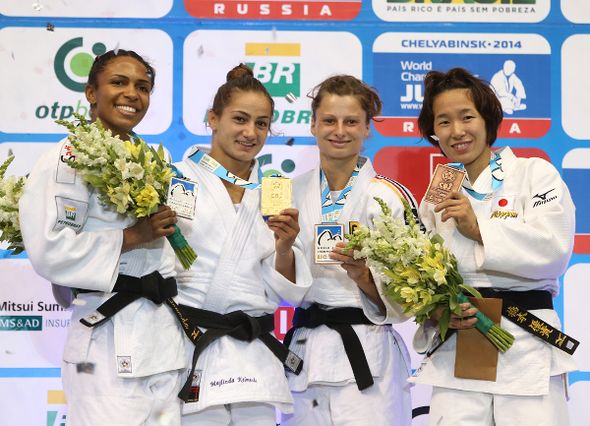 Kosovo's Majlinda Kelmendi (second left) proudly shows off the gold medal she won at the judo World Championships, along with Brazil's silver medallist Erika Miranda (left) and bronze medallists Mareen Kraeh (second right) and Japan's Yuki Hashimoto (right)