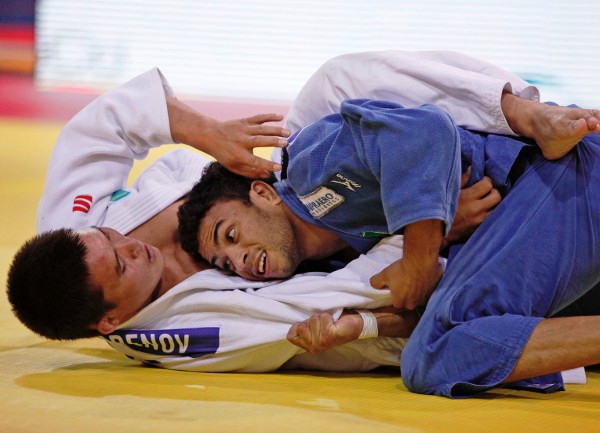 Alex William Pombo Da Silva (blue) completed a triple gold medal haul for Brazil on the first day in Almaty