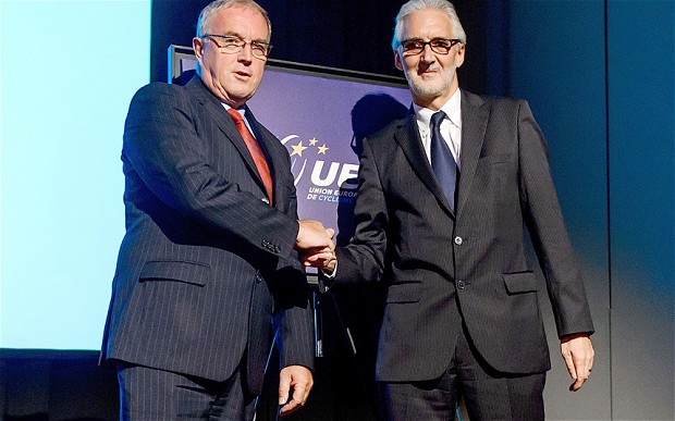 Pat McQuaid (left) and Brian Cookson (right) shake hands after their debate at the European Cycling Union Exceptional Ordinary General Assembly