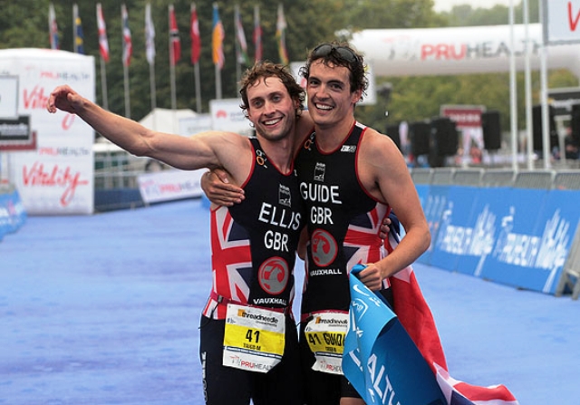 Dave Ellis (left) and his guide Luke Watson show their delight after winning the Tr1-6b category at the 2013 World Paratriathlon Championships in London