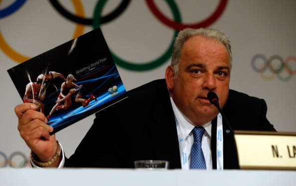 FILA President Nenad Lalovic displays wrestlings future aims in brochure form following victory in the 2020 sports race