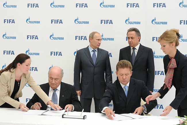 A four-year deal between FIFA and Gazprom is clinched as Russian President Vladimir Putin looks on