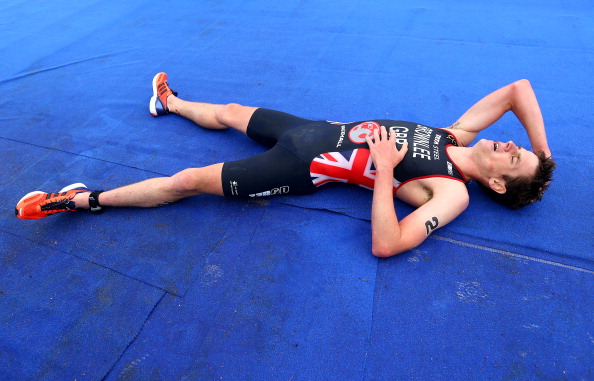 Great Britains Jonny Brownlee collapses in exhaustion and dispondency after being outsprinted by Spains Javier Gomez in Hyde Park